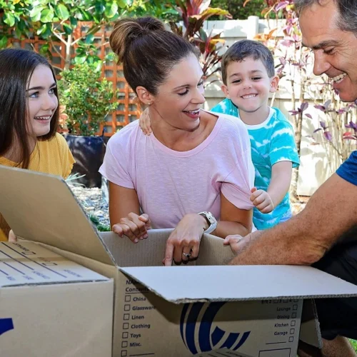 Two Cairns Removalists loading a truck as home owners leave their property.